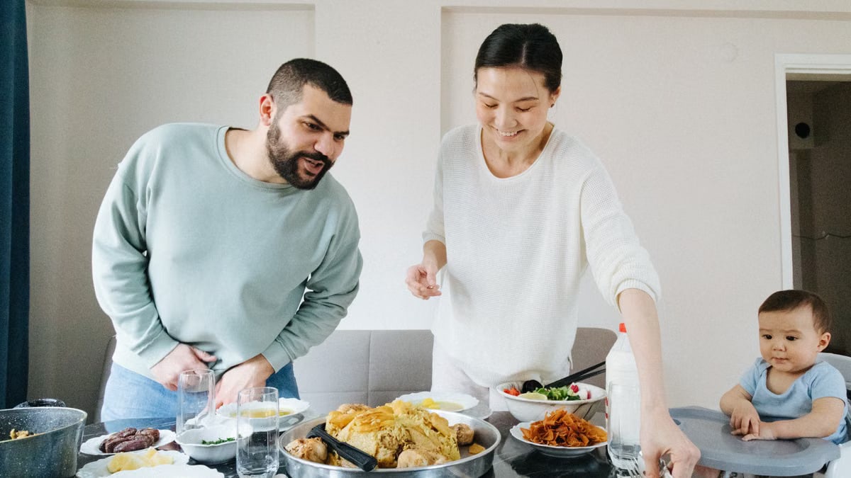 Family enjoying a meal together at home, celebrating with traditional dishes.